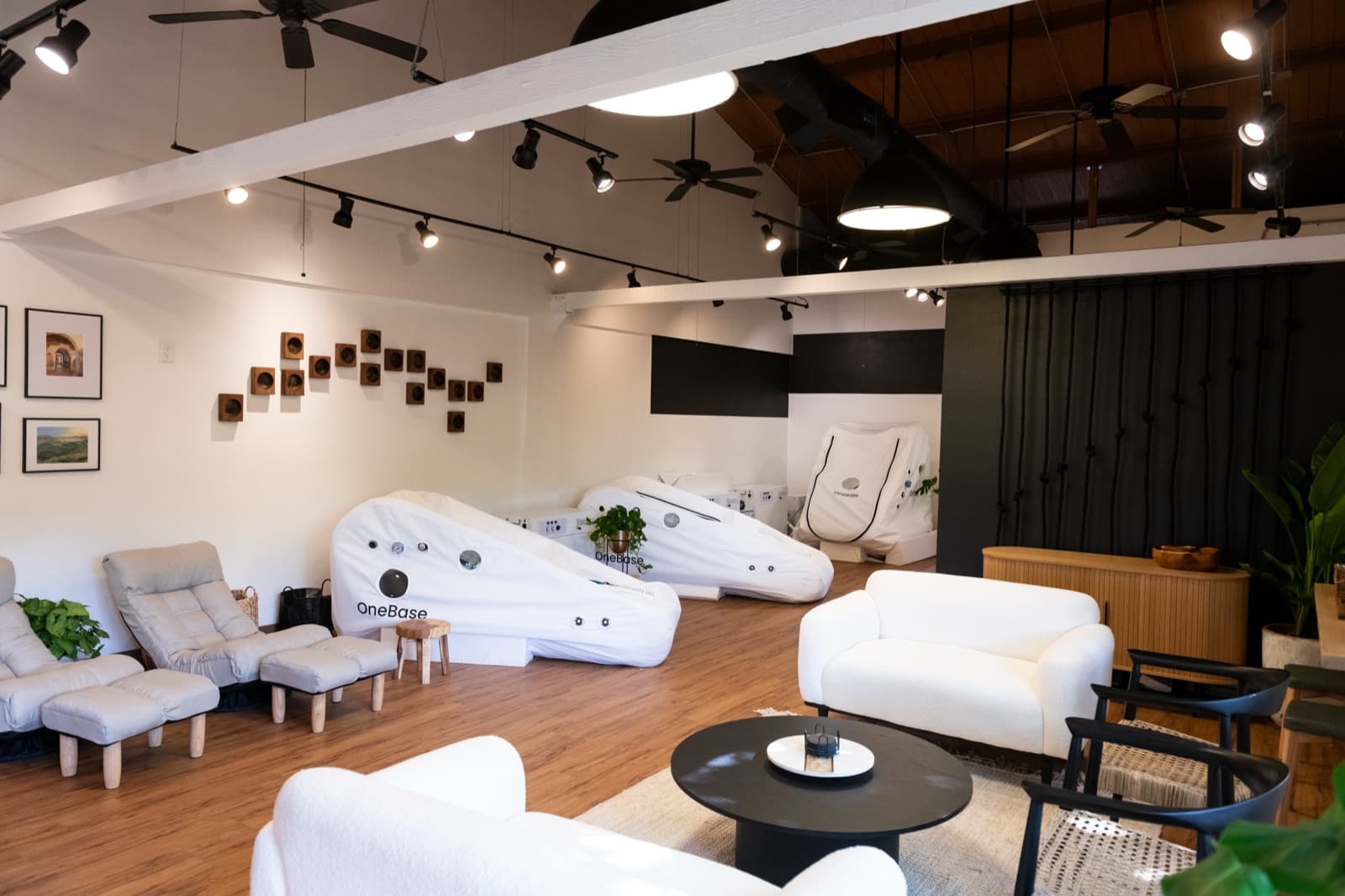 Inside Hype Wellness Studio: lounge seating and soft hyperbaric chambers