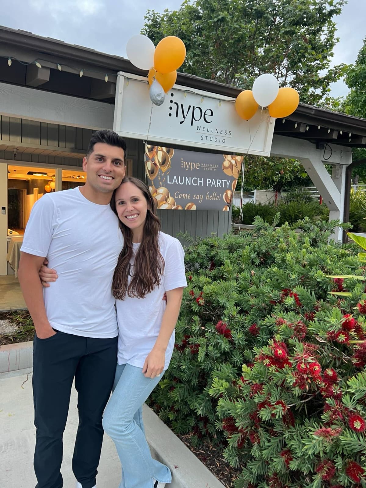 Daniel and Lauren Guzman outside Hype Wellness Studio on launch party night