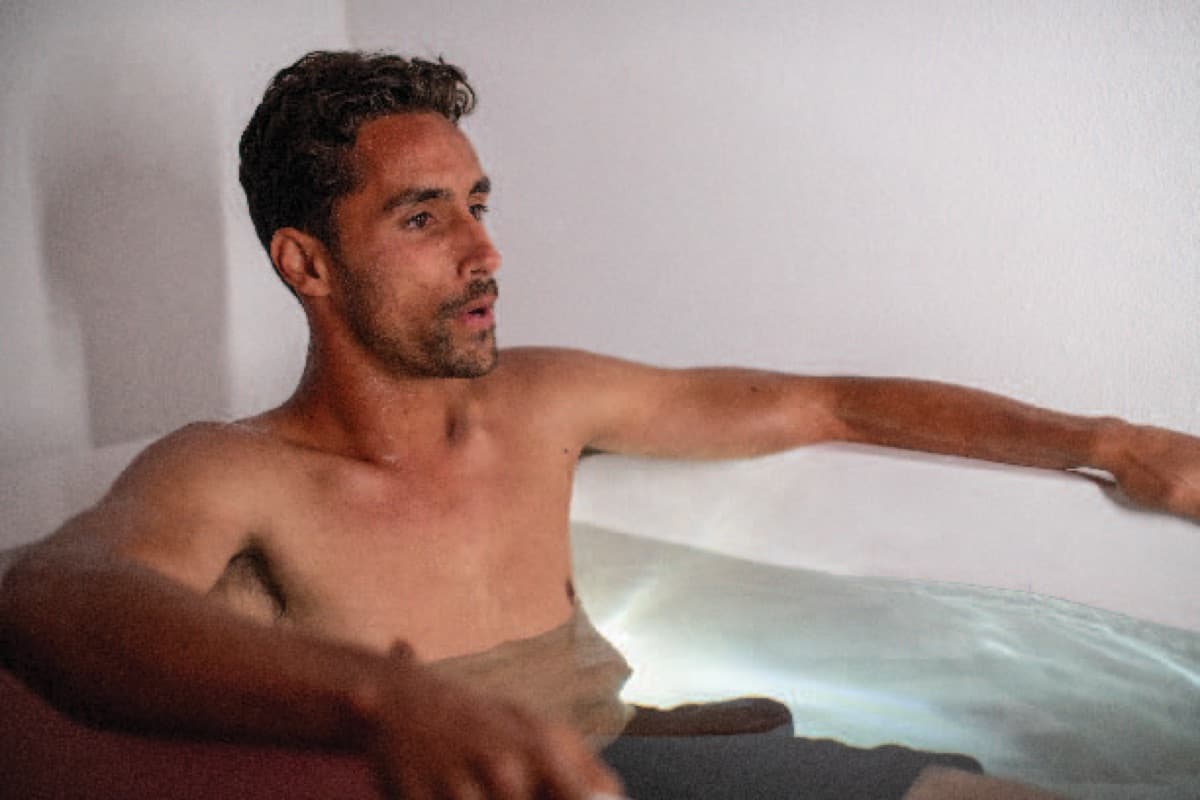 A member sitting in the cold plunge